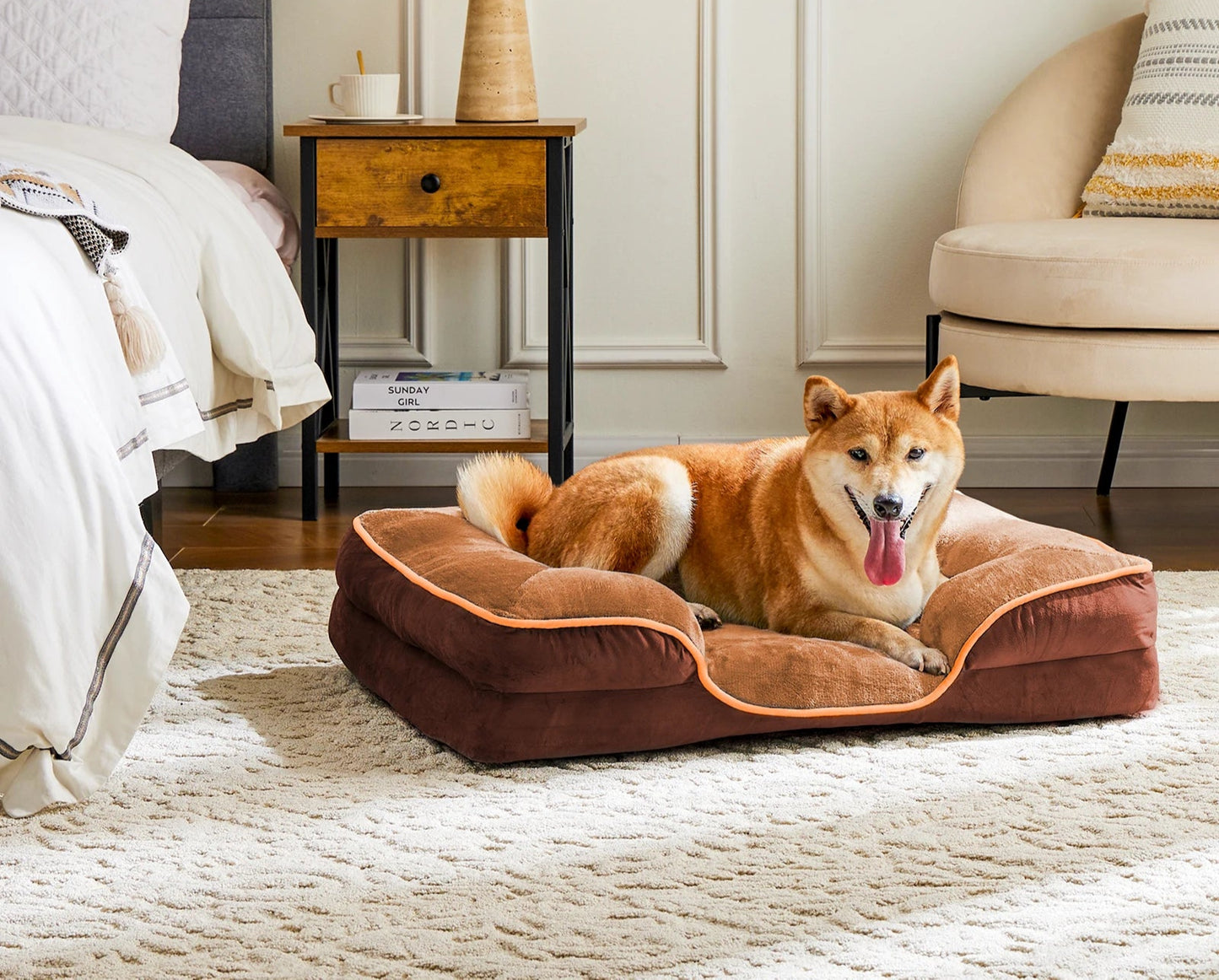 Dog lying on a brown pet bed in a cozy bedroom.
